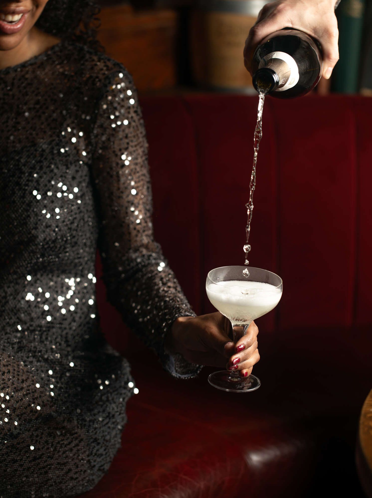 Champagne being poured from a great height